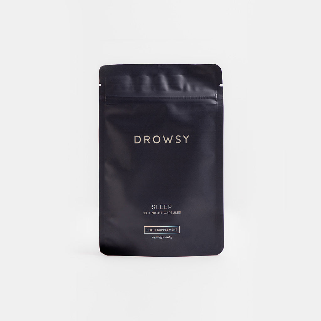 A black resealable pouch labeled drowsysleepco Sleep Supplement - 10 Capsules pack, a food supplement designed to support restful sleep and refreshed mornings, is shown standing upright against a plain white background.
