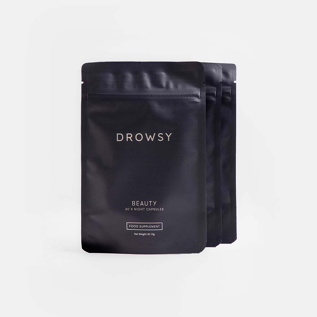 Three black resealable pouches of drowsysleepco Beauty Supplement Subscription are displayed against a plain light gray background, with the front pouch featuring a small FOOD SUPPLEMENT label near the bottom.