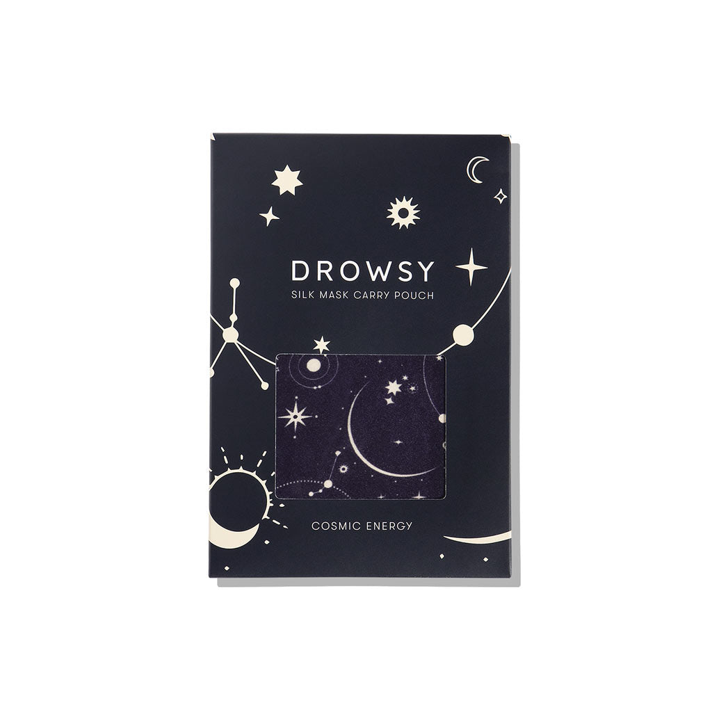A dark blue drowsysleepco Cosmic Energy Silk Carry Pouch with cosmic stars, planets, and constellations. The mulberry silk pouch inside matches the night sky pattern. Text: Drowsy Silk Mask Carry Pouch Cosmic Energy.