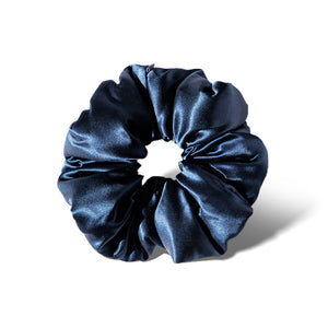 The drowsysleepco Midnight Blue Padded Scrunchie, oversized with a glossy, ruffled silk texture, is shown against a white background with a soft shadow.