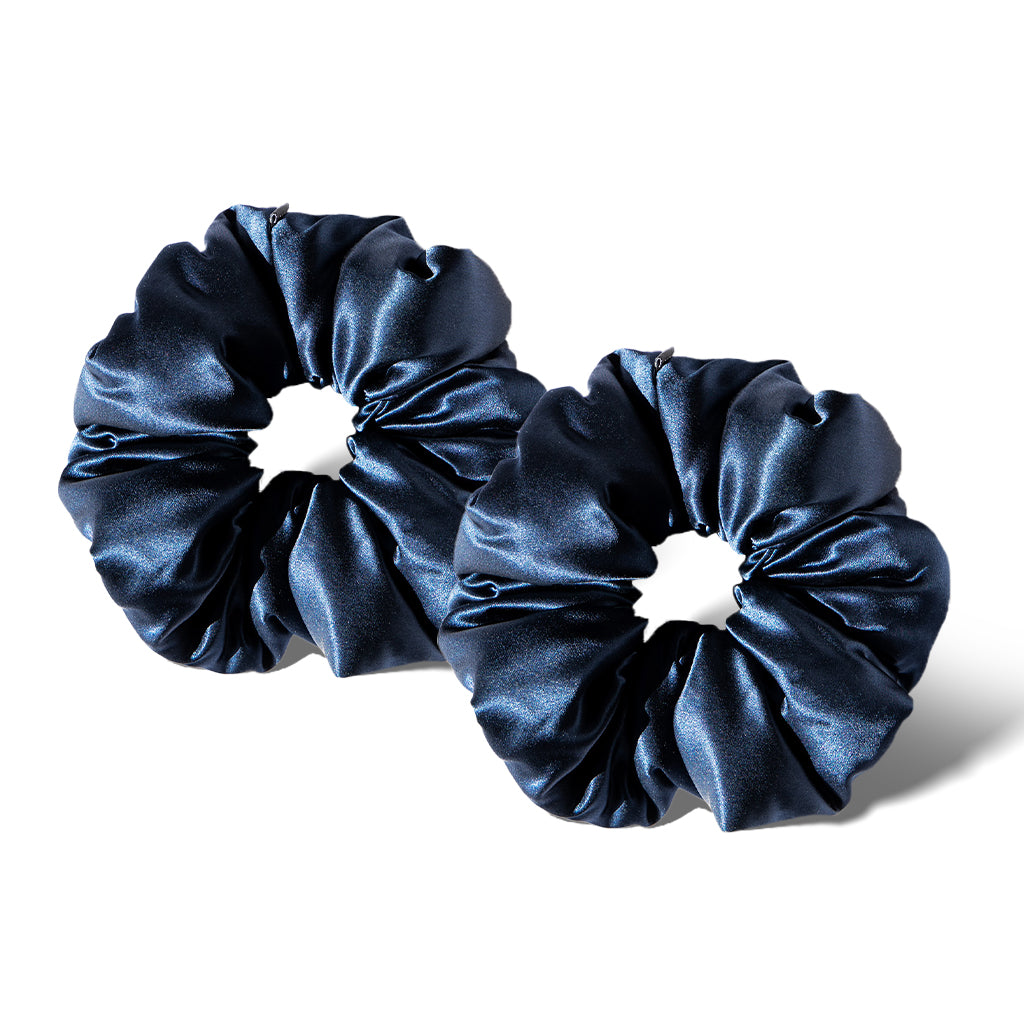 Two Midnight Blue - Padded Scrunchies by drowsysleepco are shown side by side on a white background, featuring smooth, glossy fabric for a soft, voluminous look that also supports hair health.