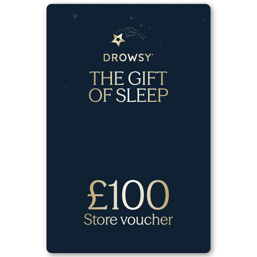 A dark blue drowsysleepco Sleep Gift Card with gold "The Gift of Sleep" text and a £100 value, featuring a small shooting star logo at the top.
