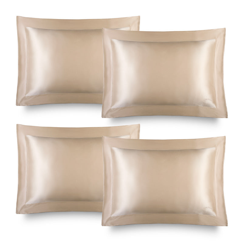 Four Hyalo Pillowcases in the shade Champagne Gold by us.drowsysleepco are arranged in two rows on a white background. Each pillowcase showcases a wide hem and a glossy, smooth texture designed to support overnight hydration for healthier-looking skin.