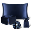 Explore the Sensual Sleep Bundle - Midnight Blue by drowsysleepco: a dark blue satin set featuring a pillowcase, sleep mask, scrunchie, and drawstring pouch, all elegantly shown against a white backdrop.