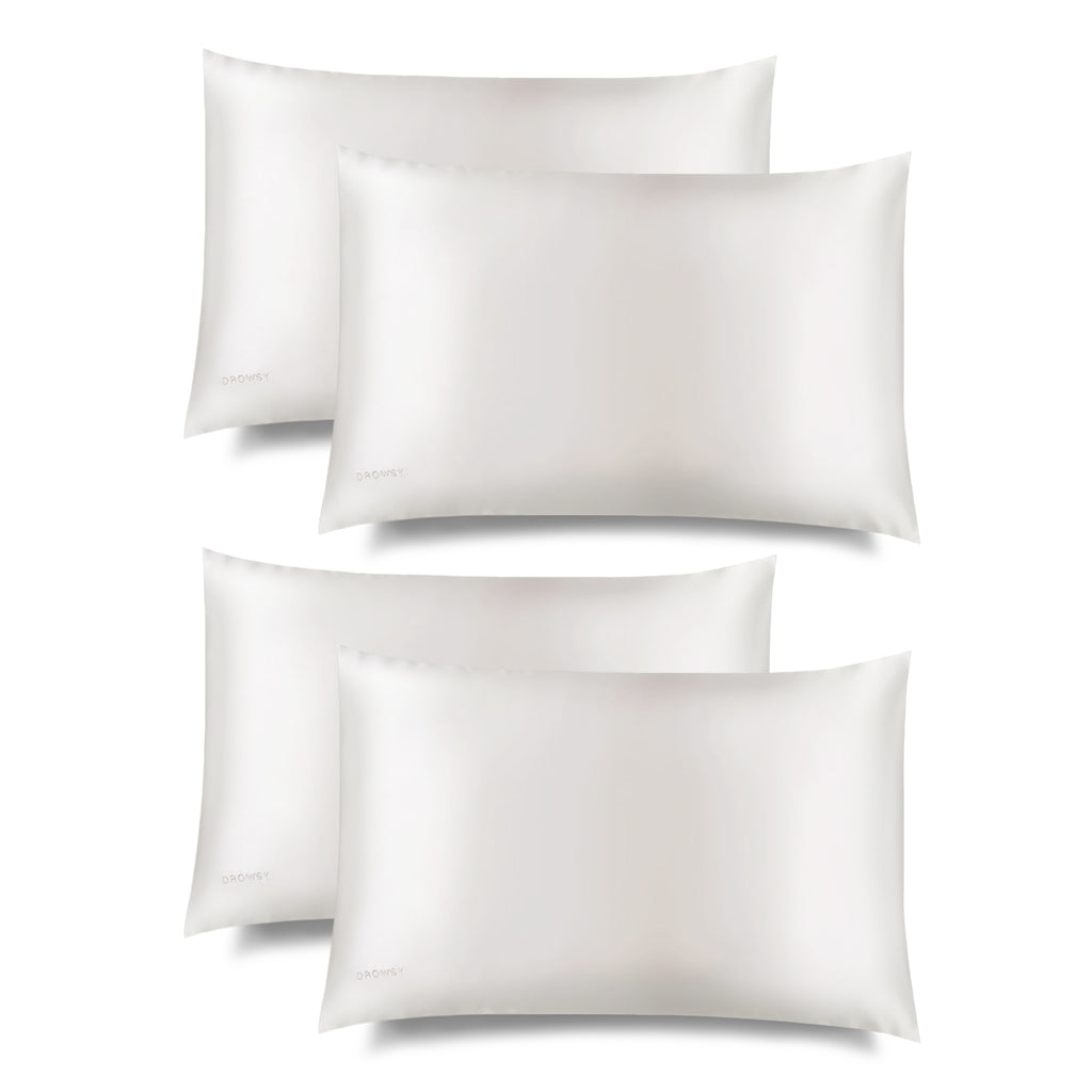 Four Akoya Pearl Silk Pillowcases by drowsysleepco, in white with a smooth, silky finish, are arranged in two rows against a plain background—ideal for hair protection and enhancing skincare as part of your beauty routine.