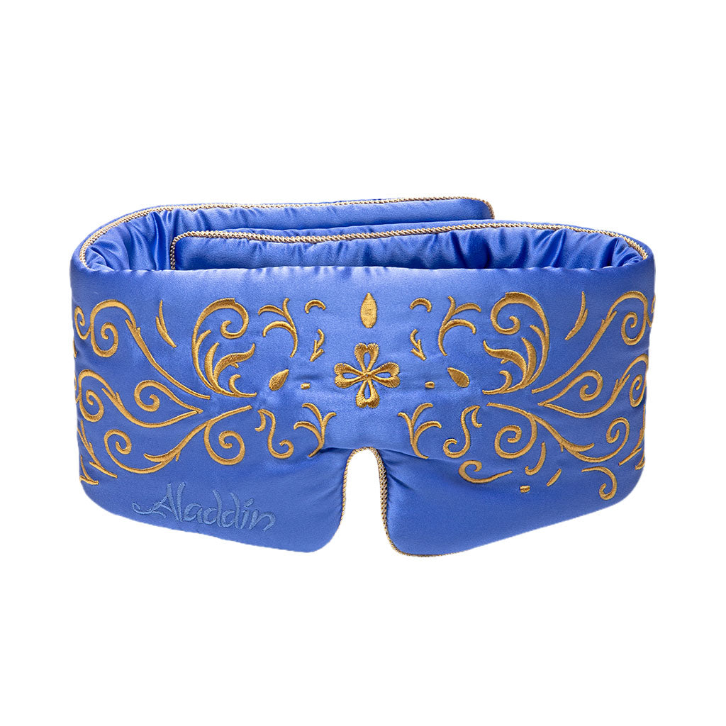 The drowsysleepco Magic Carpet Sleep Mask is a blue mulberry silk eye mask with gold embroidered swirls and "Aladdin" stitched on the lower left. A bottom center notch enhances comfort for full blackout sleep.