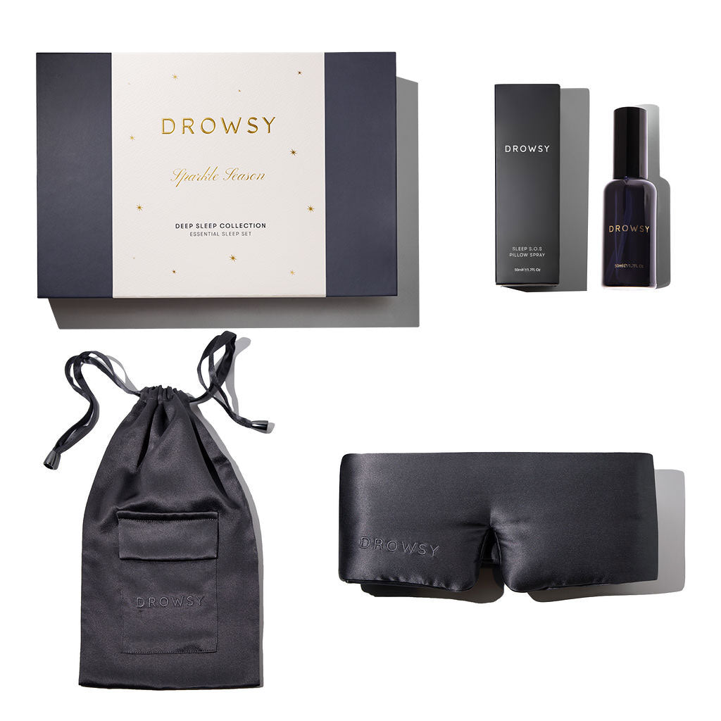 The Moonlight Shadow Deep Sleep Collection by drowsysleepco features a luxury silk sleep mask, deep sleep pillow spray in its box, and a matching drawstring pouch—all elegantly arranged on a crisp white background.