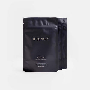 Three black resealable pouches of drowsysleepco Beauty Supplement Subscription are displayed against a plain light gray background, with the front pouch featuring a small FOOD SUPPLEMENT label near the bottom.
