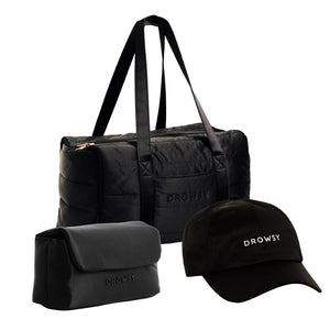 The Drowsy Weekend Collection - Black Jade features a black duffel, toiletry bag, and cap—all by Drowsy, with DROWSY embroidered in white on the duffel and cap—displayed on a white background.