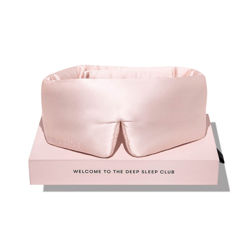 Light pink Drowsy silk sleep mask and box on a white background