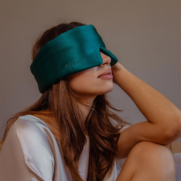 Model wearing Drowsy Green Sapphire silk sleep mask