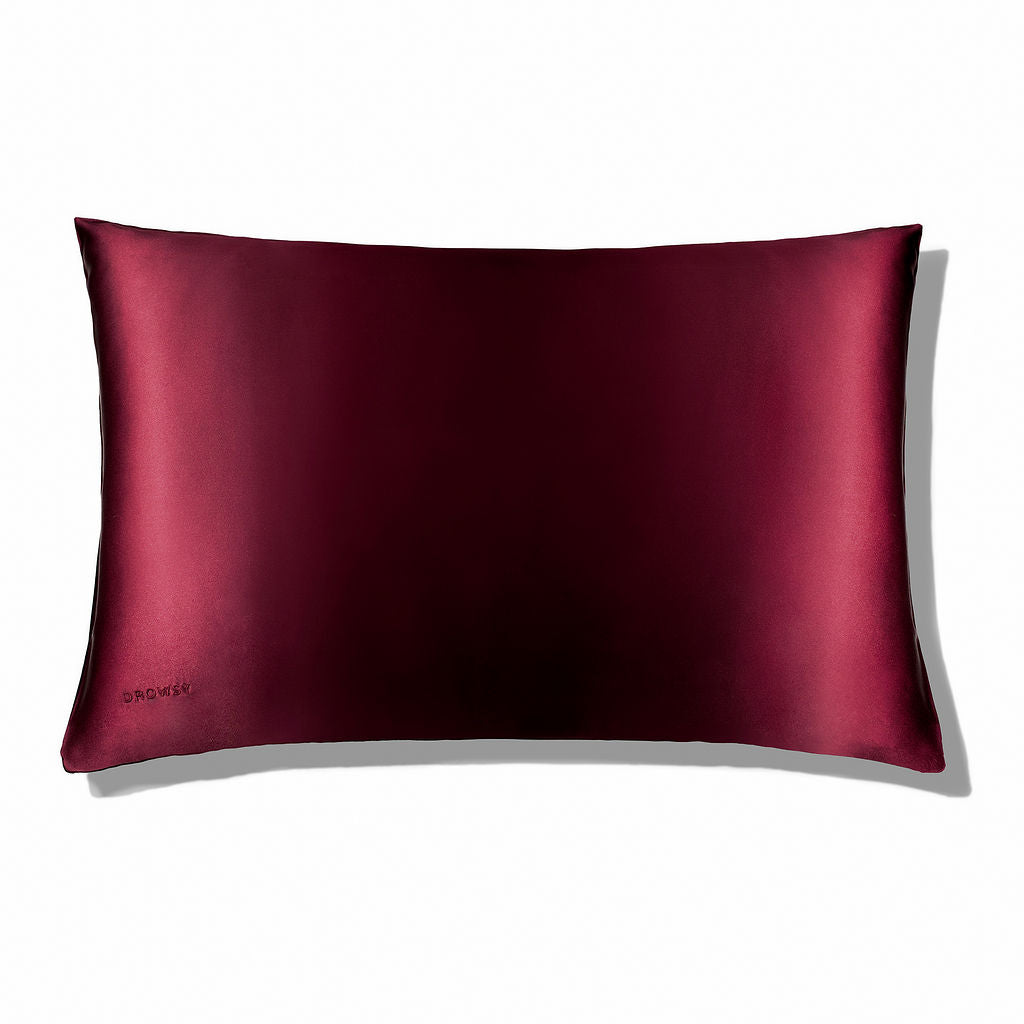 Rouge coloured Drowsy silk pillowcase on a white background