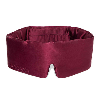 Rouge coloured Drowsy silk sleep mask on white background