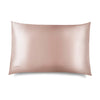 The Sunset Pink Silk Pillowcase by drowsysleepco is a smooth, rectangular, light pink silk case with a subtle sheen, designed for hair and skin benefits, featuring a small DROWSY logo in the bottom left corner on a white background.
