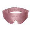 The Damask Rose Featherweight Silk Sleep Mask by drowsysleepco is a silky pink mulberry silk mask designed to cover your eyes and block out light for better sleep, featuring the word “DROWSY” embroidered on the front.