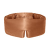 Burnt orange coloured Drowsy silk sleep mask on a white background