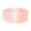 Model wearing Drowsy Sunset Pink Silk Sleep Mask over eyes against a white backdrop
