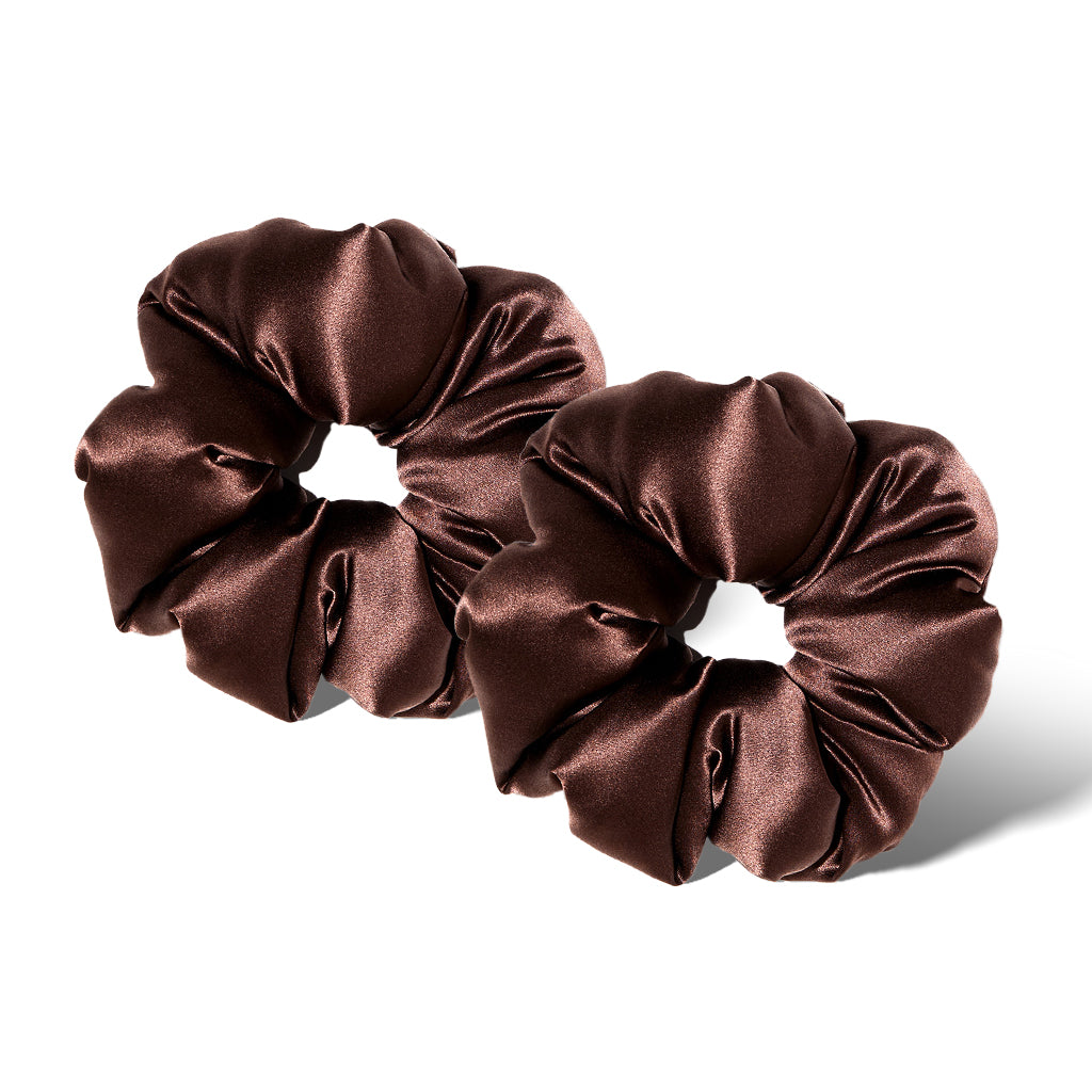 Two Cocoa Glow - Padded Scrunchies by drowsysleepco, large and shiny in dark brown silk, are placed side by side on a white background with soft shadows.