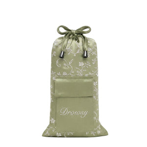 Pride & Prejudice - Sage Carry Pouch, a sage green mulberry silk drawstring pouch featuring a white floral pattern and a front pocket embroidered with the word Drowsy.