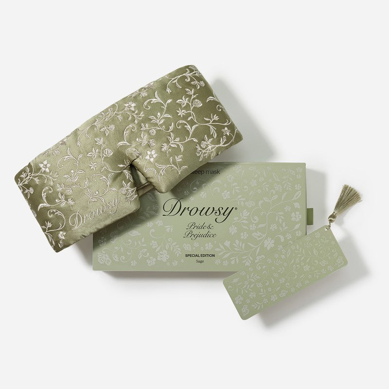 Pride & Prejudice - Sage + English Rose Sleep Mask in sage green mulberry silk, displayed next to its matching branded gift box and a decorative tassel bookmark.