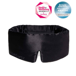 black silk sleep mask on white background with beauty awards