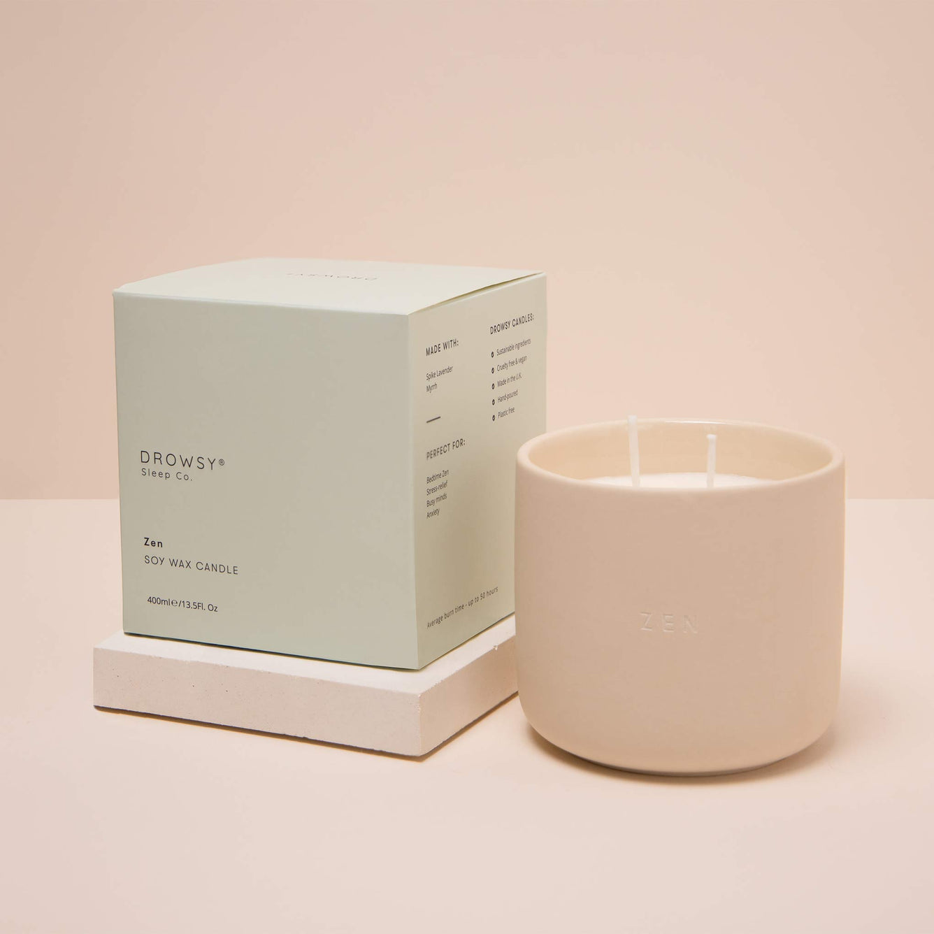 Pale green Drowsy Sleep Co. candle box with ceramic candle jar on cream coloured background