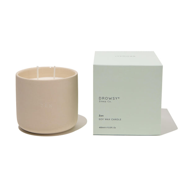 Pale green Drowsy Sleep co. candle box with ceramic candle jar on white background