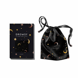 Star patterned silk pouch and box on white background